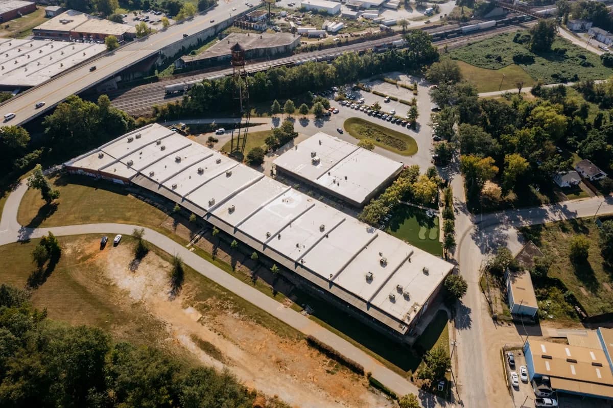 Aerial view of a low-slope roof under repair