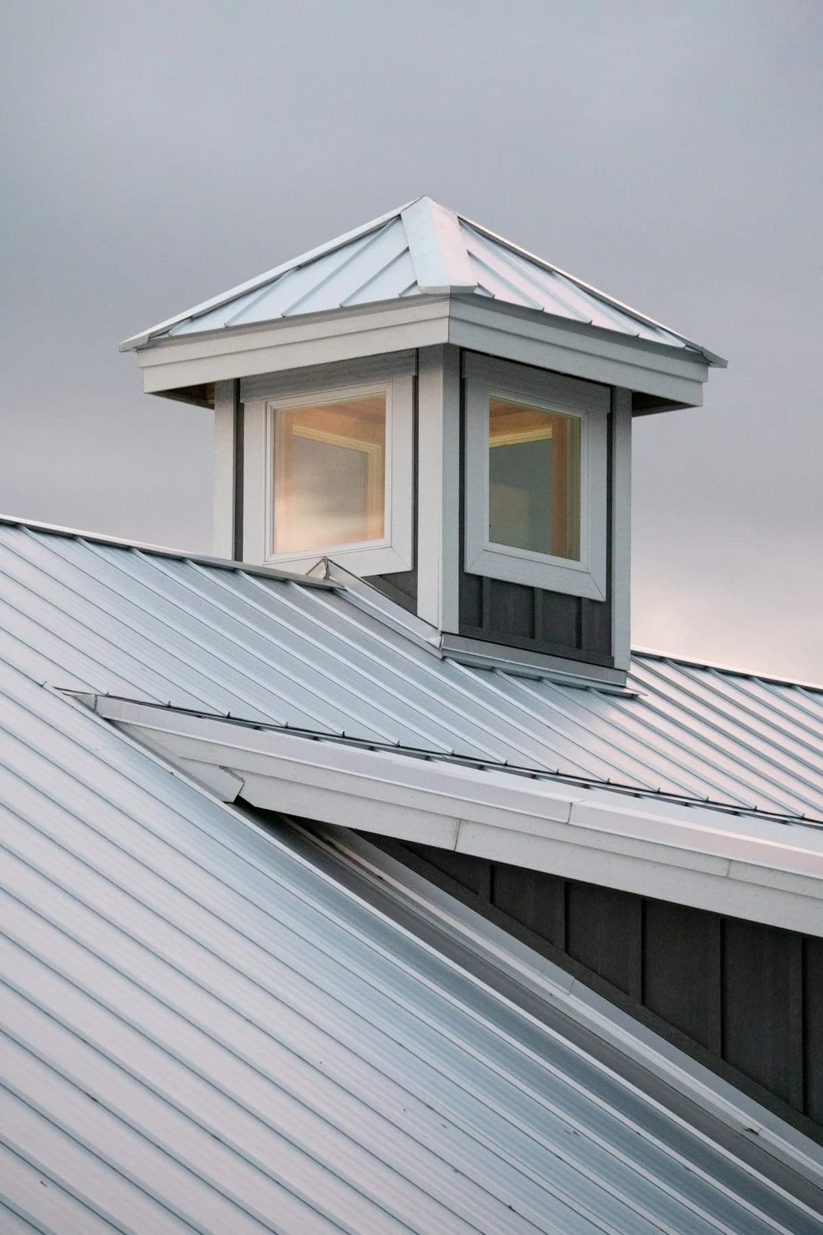Standing seam metal roof with a windowed cupola