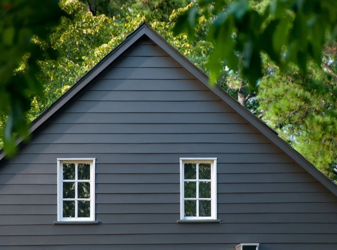 Dark-gray fiber cement siding after the full re-side