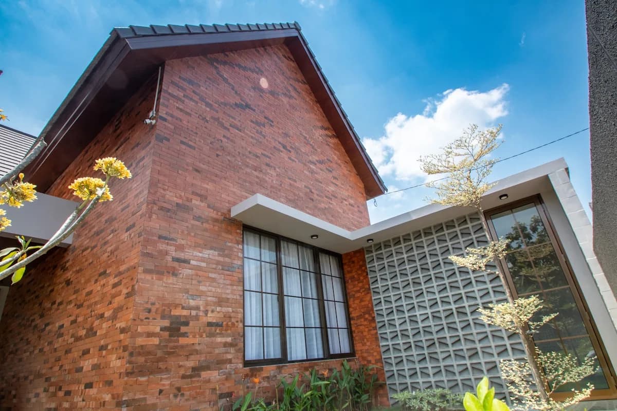Large modern windows across a brick facade